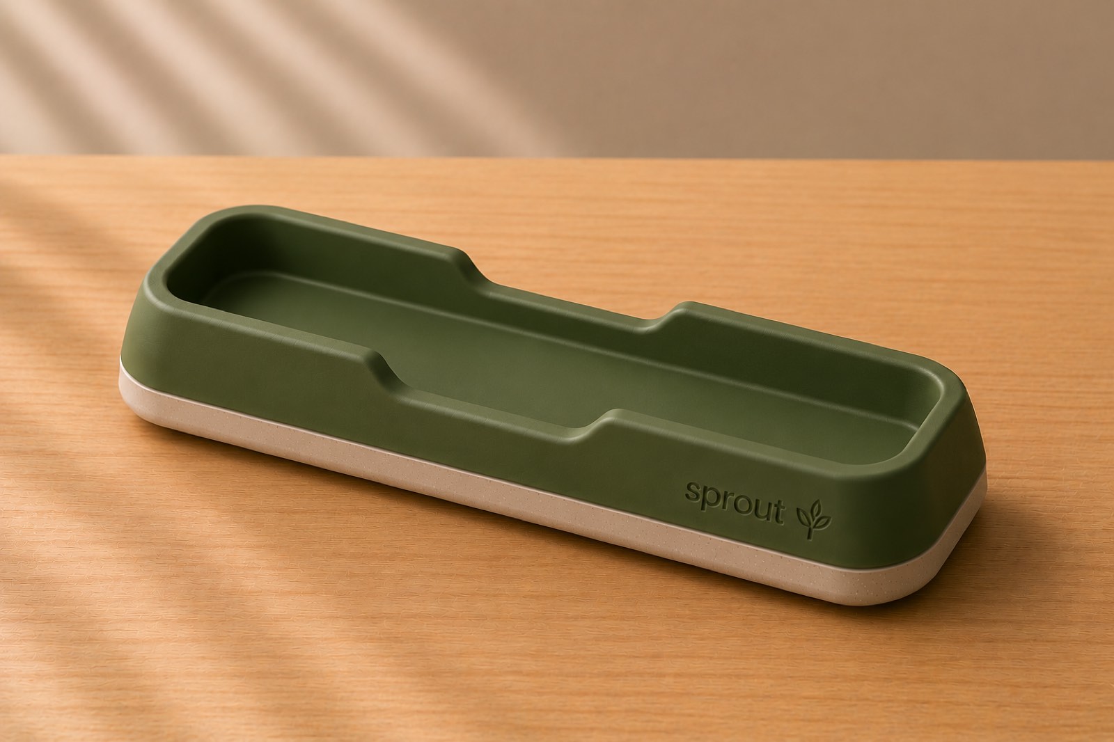 Sprout TeleWorks olive-green cradle, empty, photographed on a pale wood surface in a cream room.